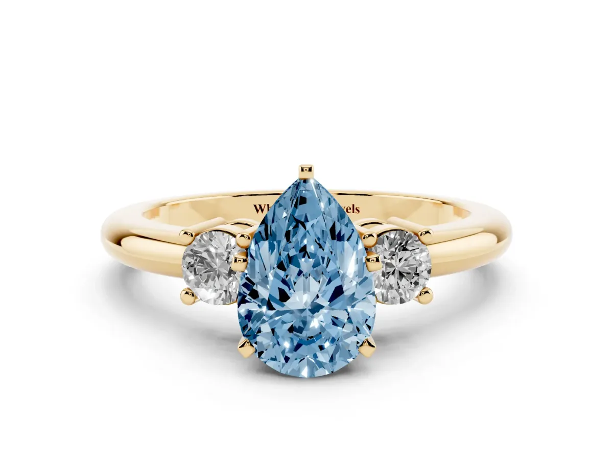 Fancy Blue Three-Stone Pear Cut Cut Diamond Solitaire with Prong Setting and Classic Band Yellow gold