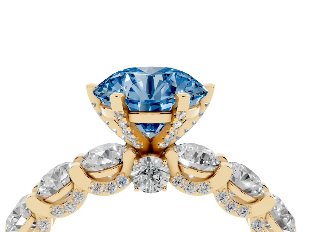 Fancy Blue Round Cut Diamond Side Stone Engagement Ring with Four-Prong Setting Yellow gold