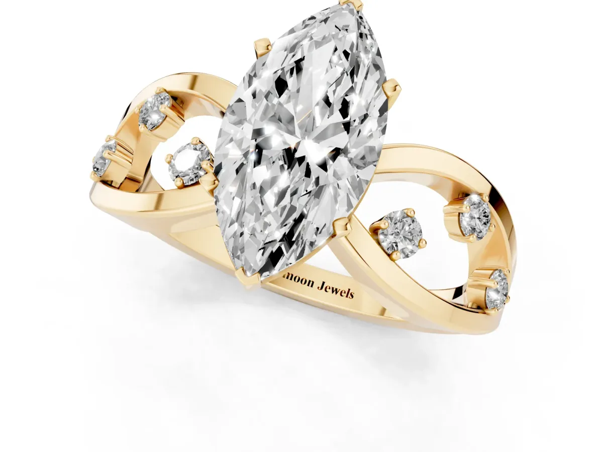 Marquise Cut Cut Solitaire Diamond with Side Stones on Criss-Cross Band and Four-Prong Setting Yellow gold