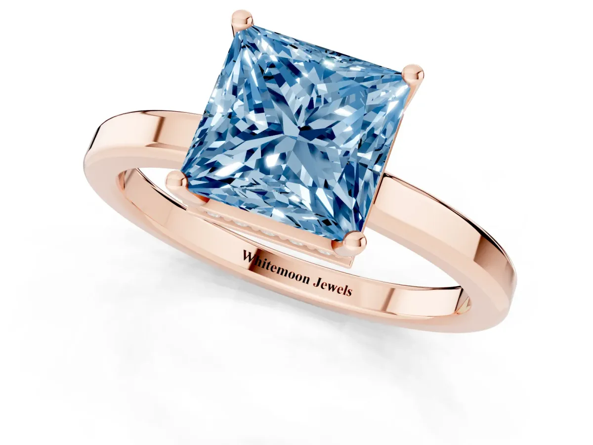 Fancy Blue Princess Cut Cut Solitaire Engagement Ring with Four-Prong Setting on a Classic Band Rose gold