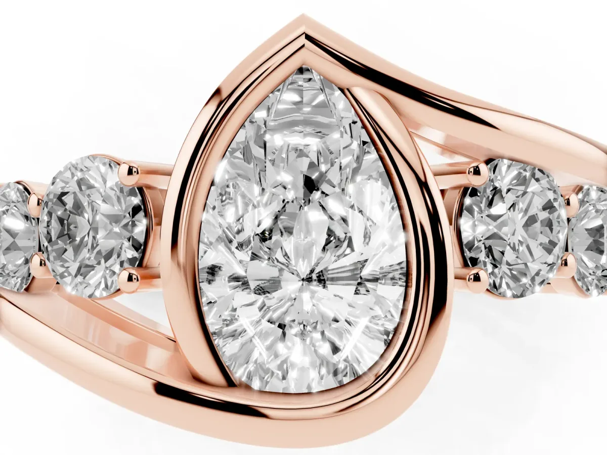 Bezel Set Pear Cut Diamond Bypass Ring with Round Accents Rose gold