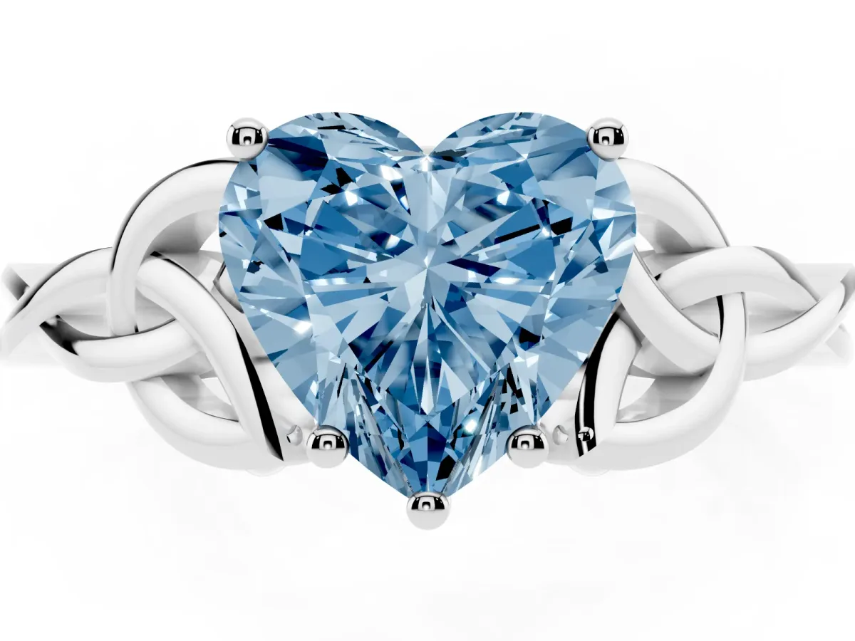 Fancy Blue Heart Cut Diamond Solitaire Engagement Ring with Celtic Knot Band and Four-Prong Setting Silver
