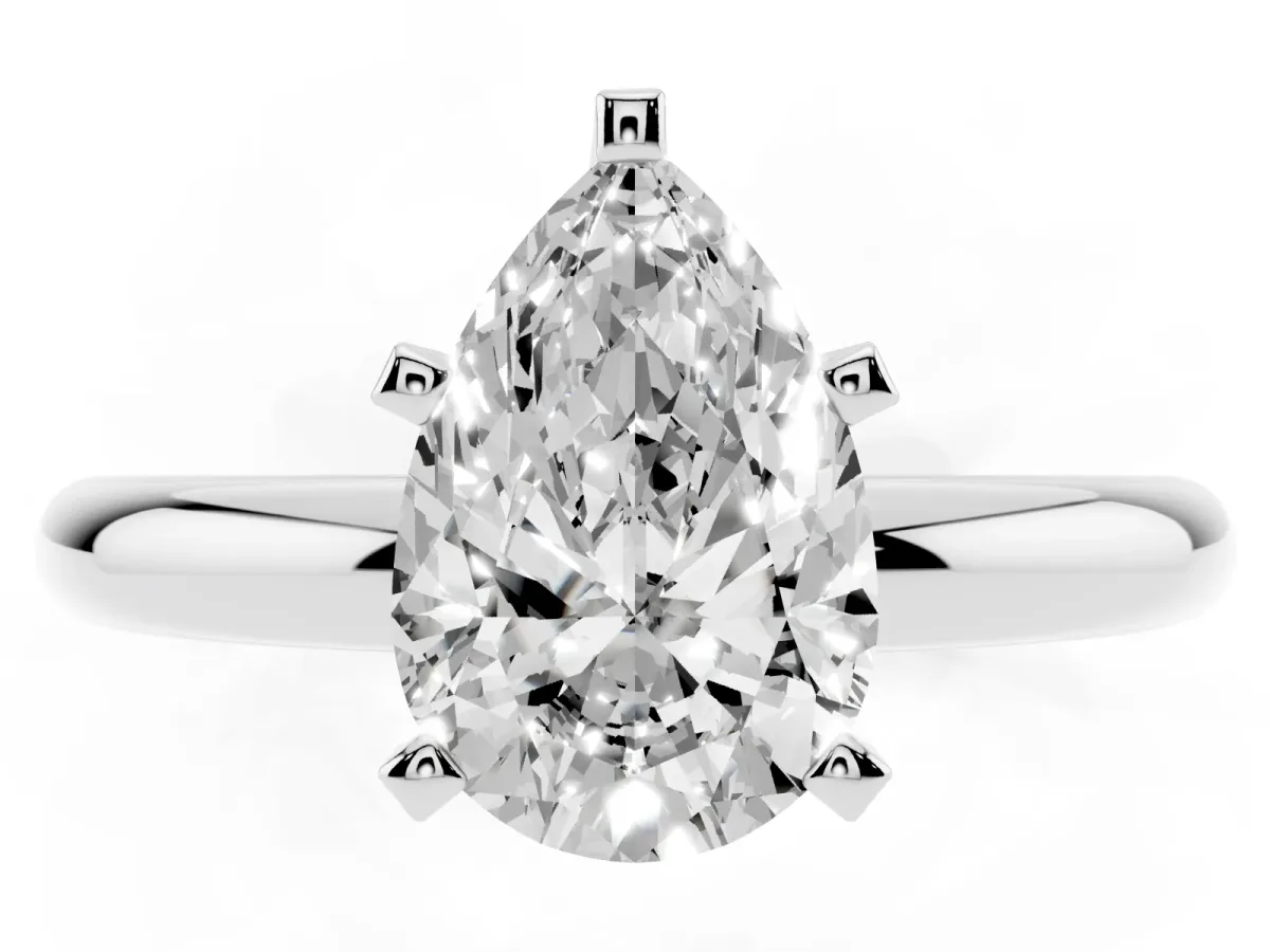 Pear Cut Diamond Solitaire Engagement Ring with Round Band and Four-Prong Setting White gold