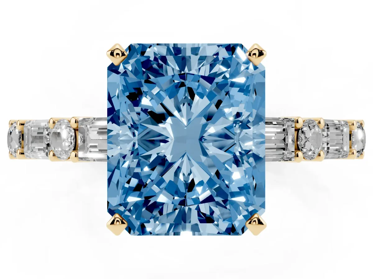 Fancy Blue Radiant Cut Diamond Solitaire with Side Baguettes and Channel Set Band Yellow gold