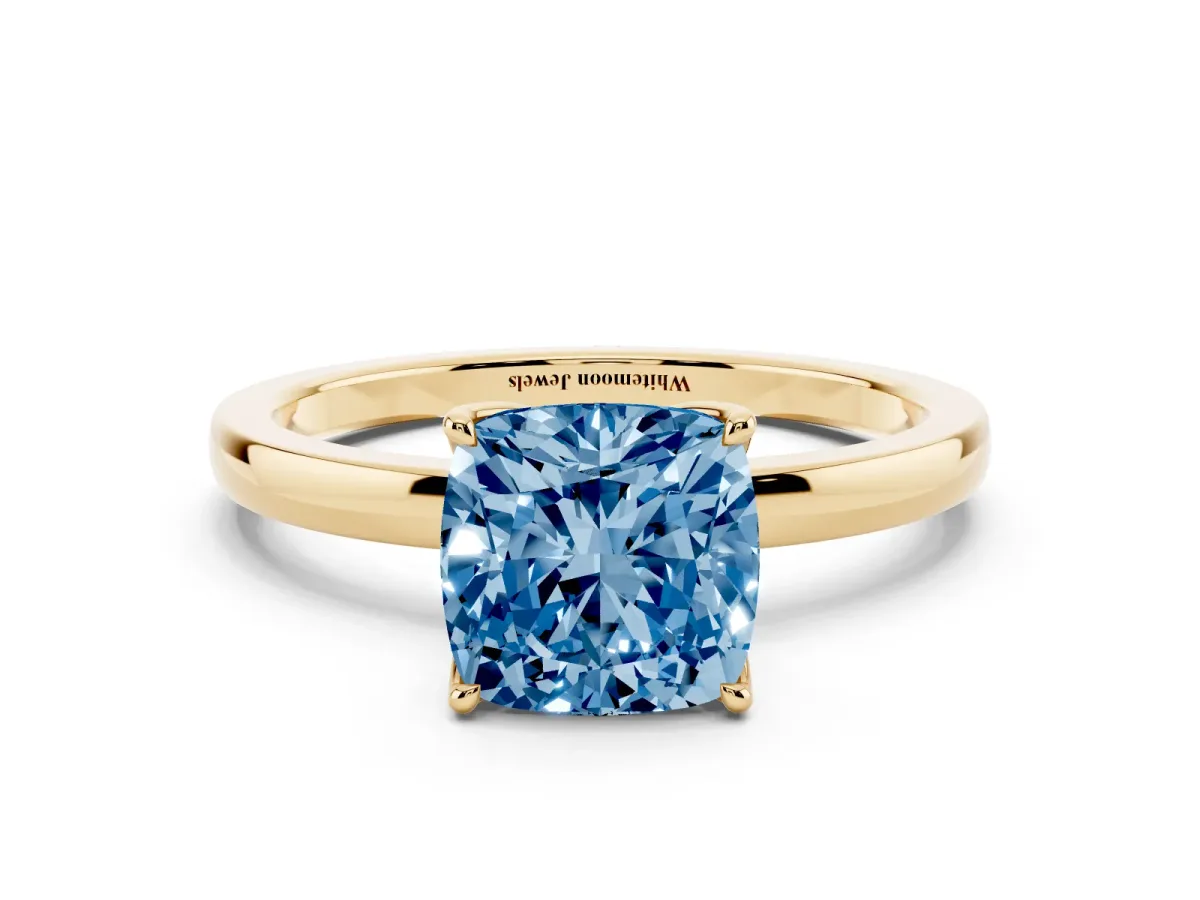 Fancy Blue Cushion Cut Diamond Solitaire Ring with Thin Band and Prong Setting Yellow gold