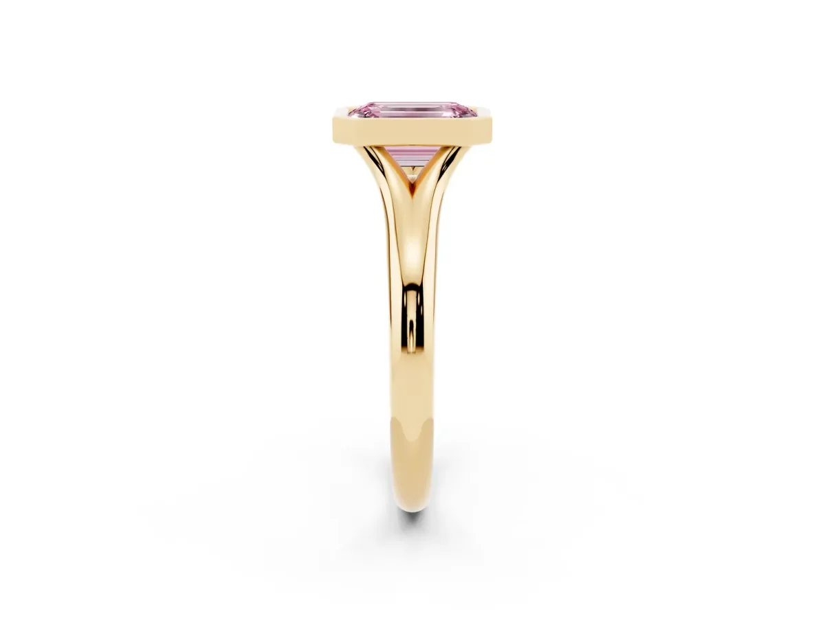 Fancy Pink Bezel Set Emerald Cut Solitaire Diamond Ring with Smooth Band Yellow gold