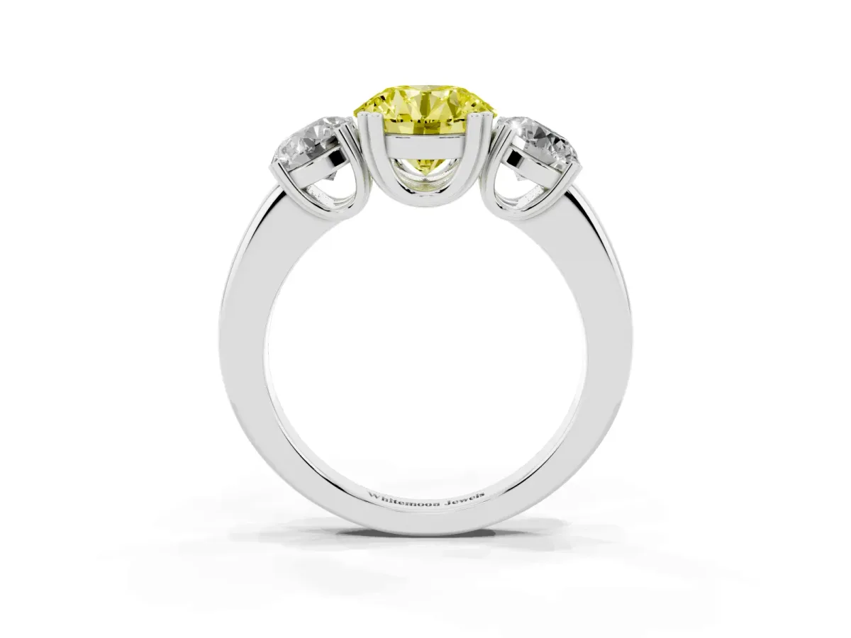 Fancy Yellow Three-Stone Round Cut Cut Diamond Ring with Channel Set Band and Four-Prong Setting Platinum