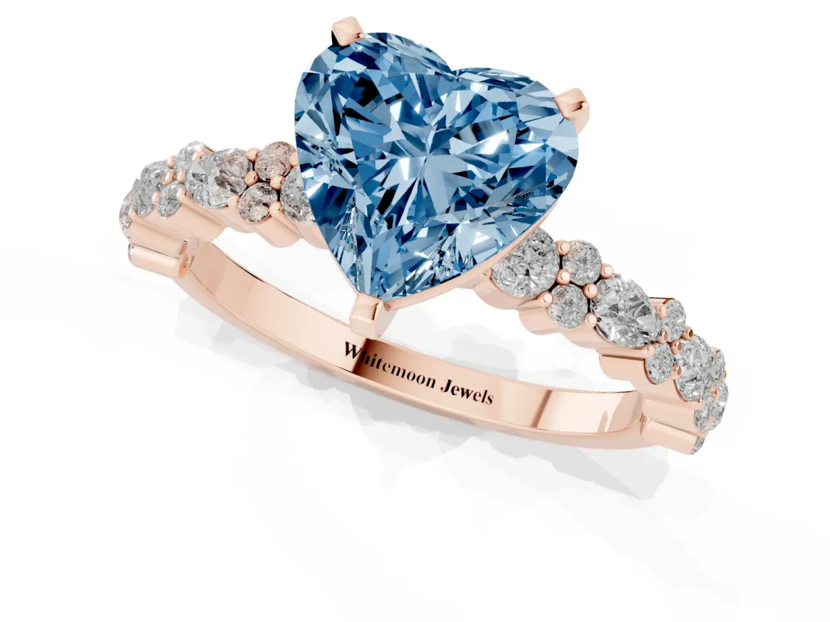Fancy Blue Heart Cut Diamond Side Stone Solitaire Ring with Round and Four-Prong Setting Rose gold