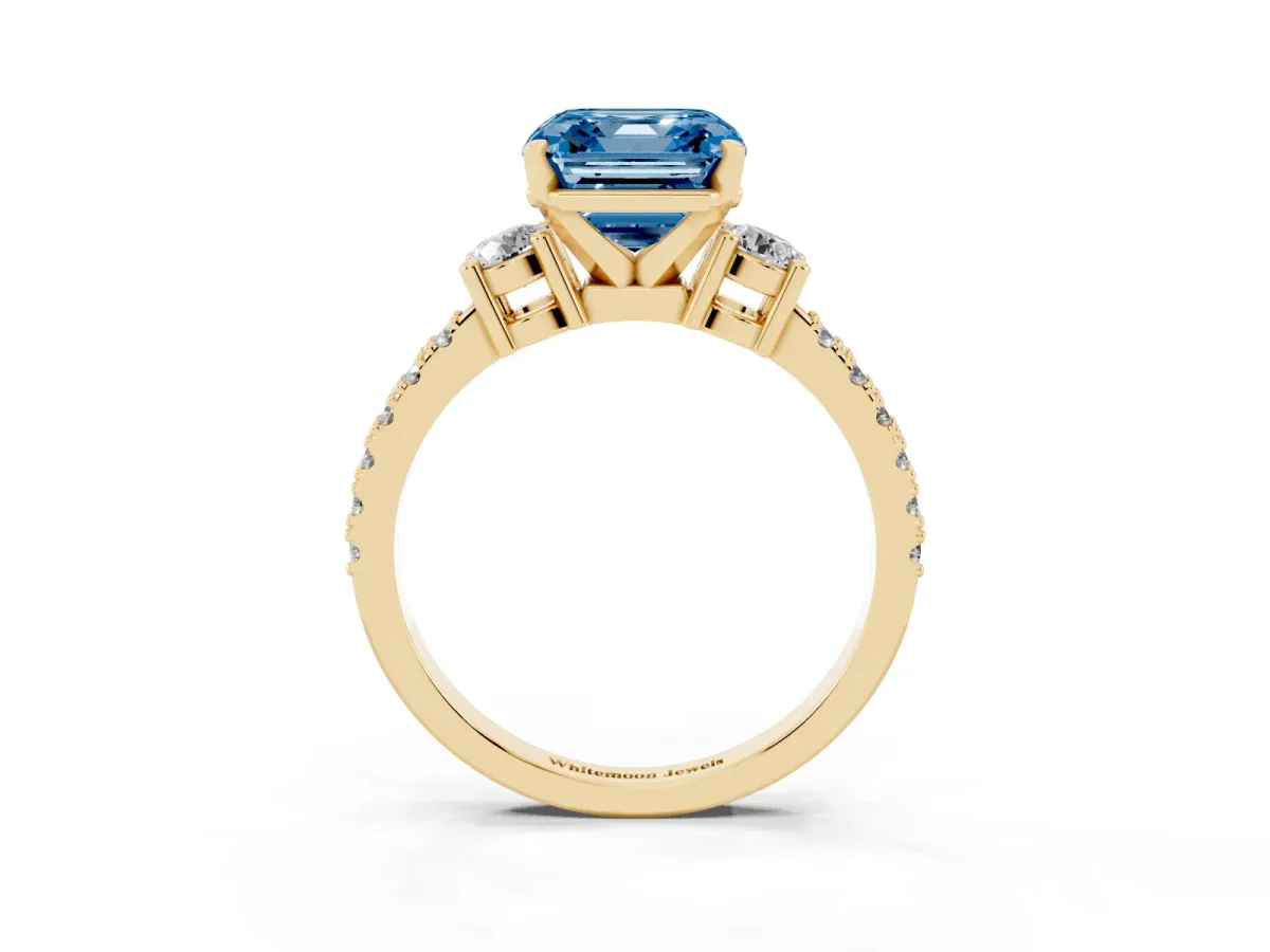 Fancy Blue Asscher Cut Three-Stone Diamond Pavé Band with Prong Setting Yellow gold