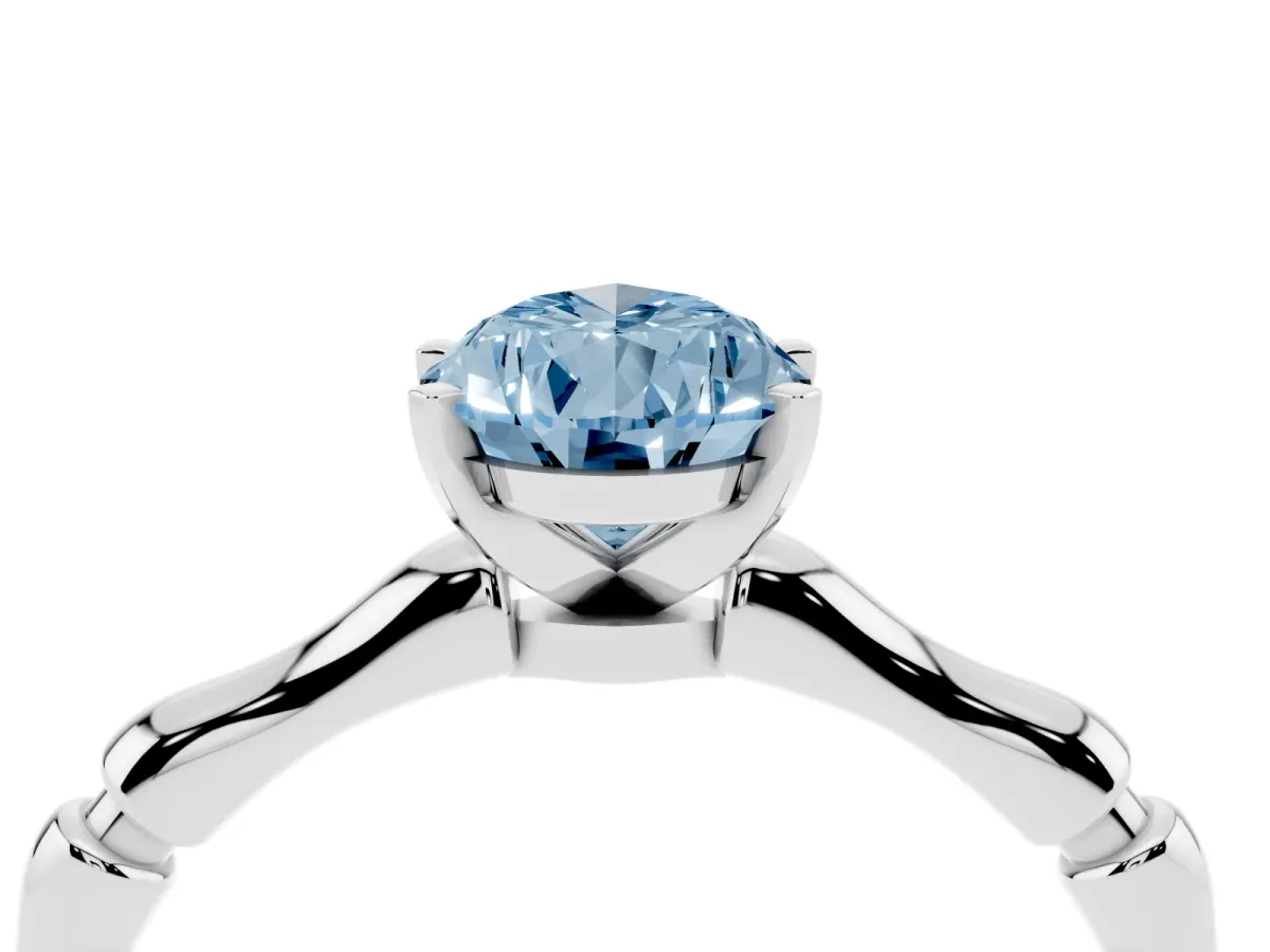 Fancy Blue Pear Cut Solitaire Diamond Ring with Bamboo Band and Four-Prong Setting Platinum