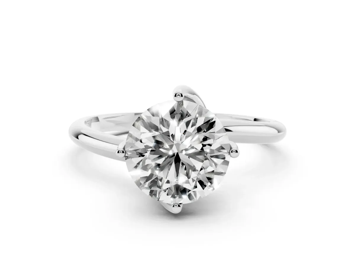 Round Cut Diamond Solitaire Engagement Ring with Four-Prong Setting and Classic Band Silver