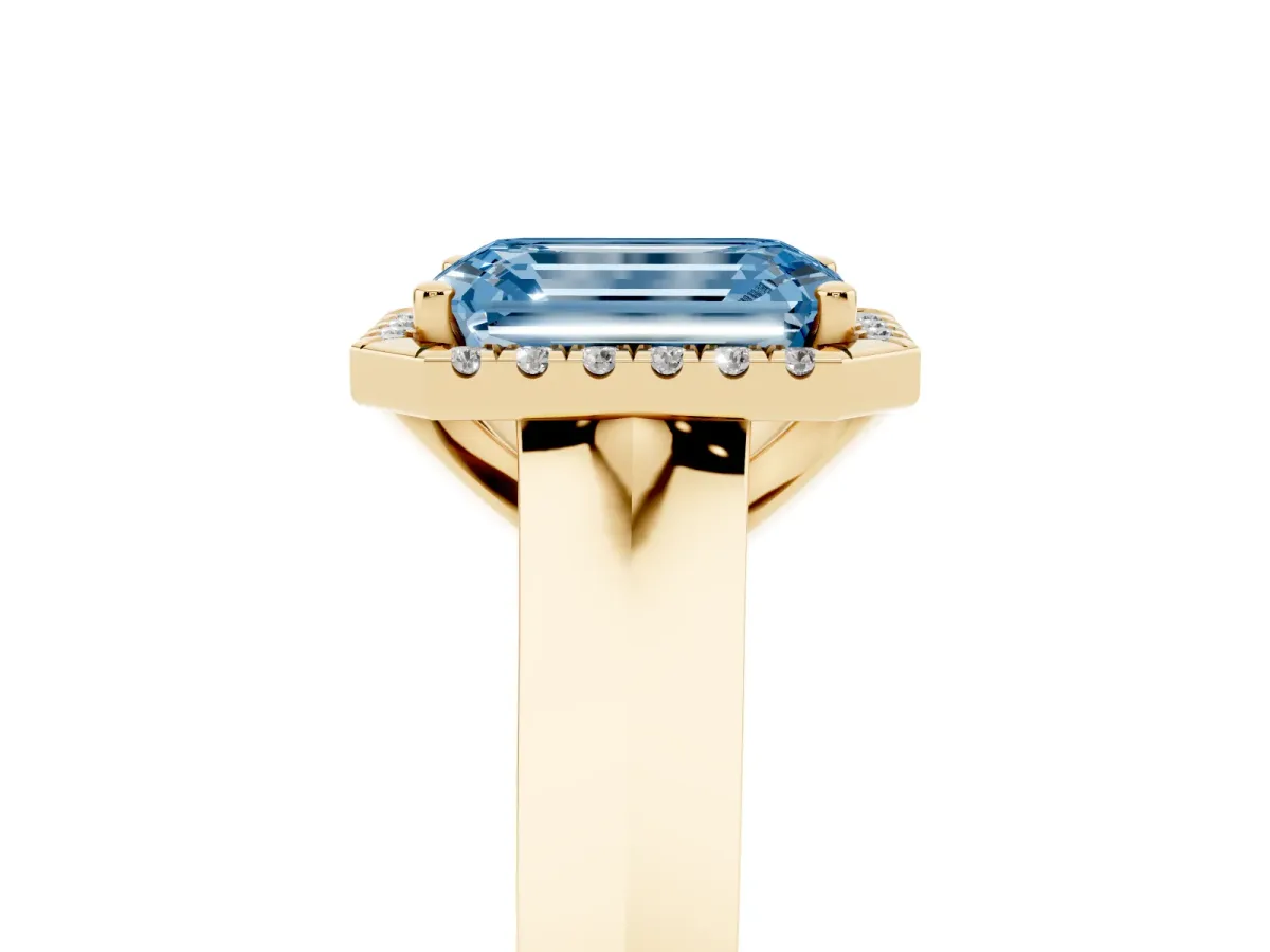 Fancy Blue Emerald Cut Halo Diamond Ring with Cathedral Band and Four-Prong Setting Yellow gold
