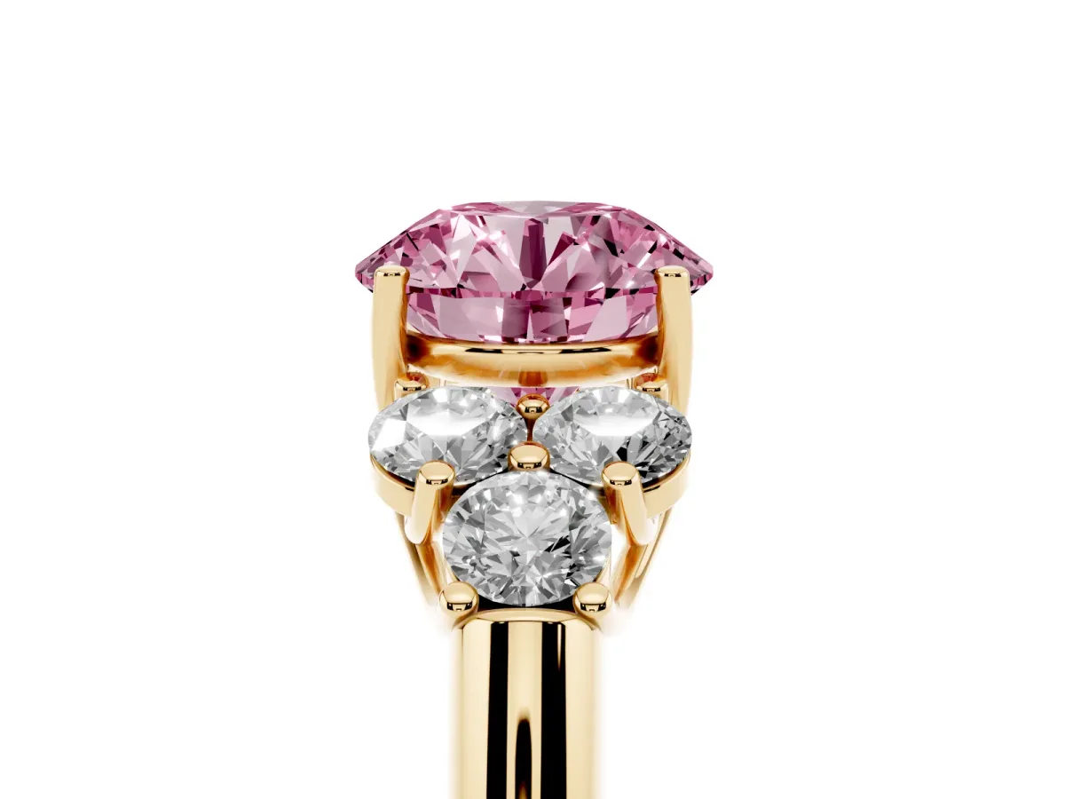 Fancy Pink Round Cut Cut Diamond Cluster Ring with Round Accent Stones and Prong Setting on a Classic Band Yellow gold