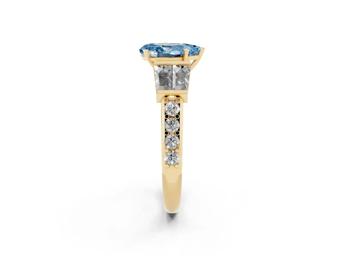 Fancy Blue Pear Cut Diamond Engagement Ring with Baguette Side Stones and Channel Set Band Yellow gold
