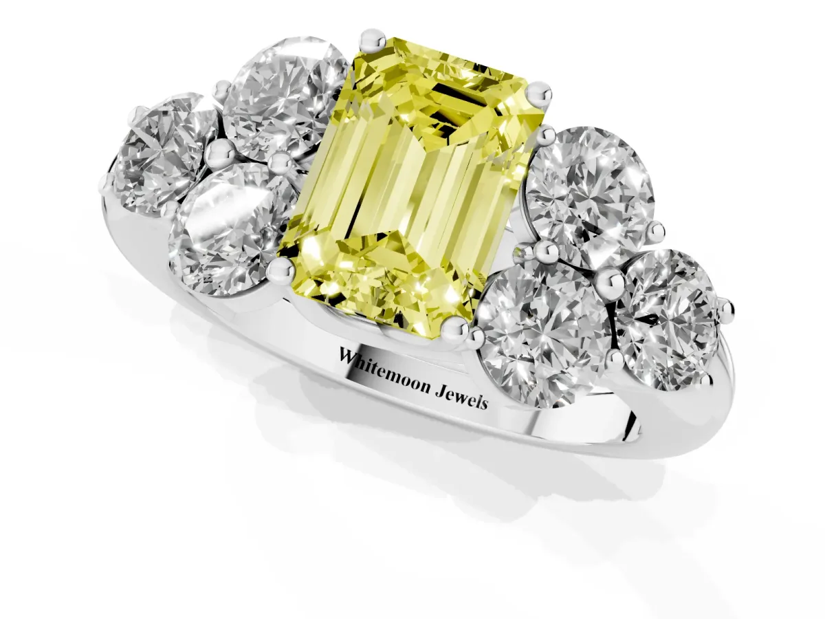 Fancy Yellow Emerald Cut Cut Diamond Cluster Ring with Round Accent Stones and Prong Setting on a Classic Band Silver