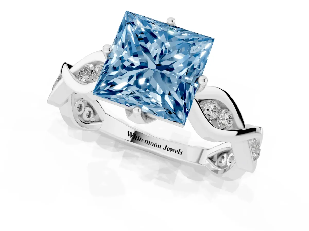 Fancy Blue Princess Cut Solitaire Twist Band with Leaf Prong Setting Silver