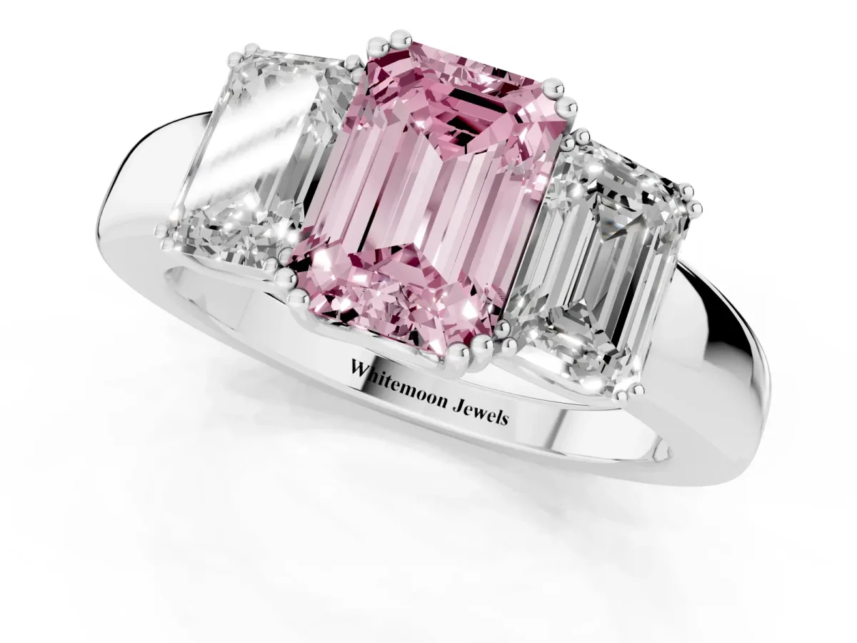Fancy Pink Three-Stone Emerald Cut Cut Diamond Ring with Channel Set Band and Four-Prong Setting Silver