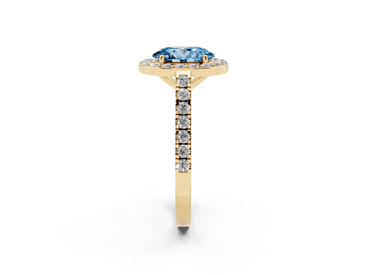 Fancy Blue Oval Cut Diamond Halo Ring with Round Pavé Split Shank and Prong Setting Yellow gold