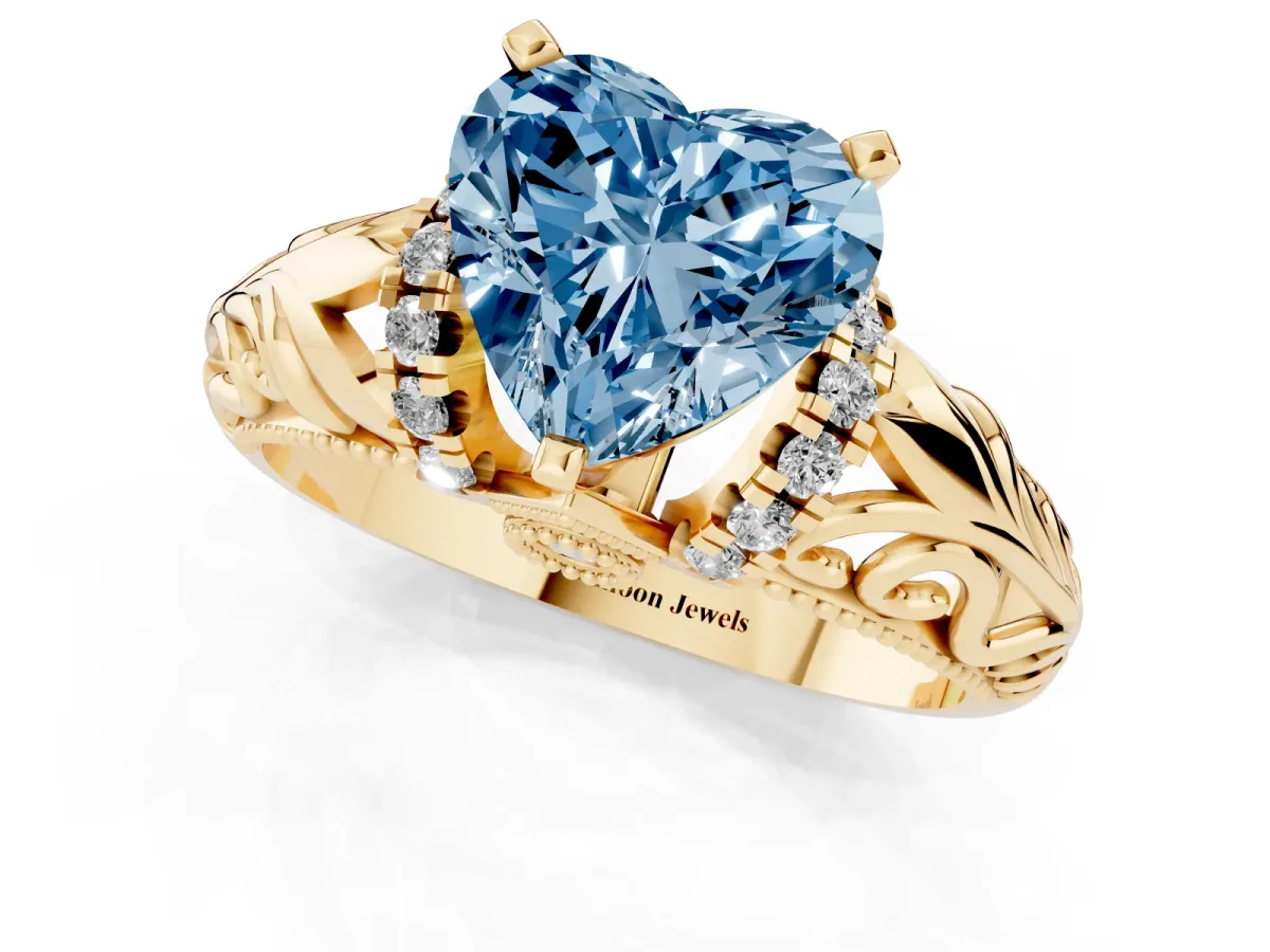 Fancy Blue Heart Cut Solitaire Filigree Engagement Ring with Halo and Prong Setting Yellow gold