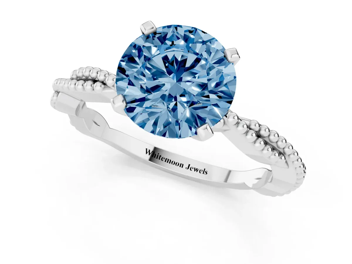 Fancy Blue Round Cut Solitaire Twisted Band with Bead Prong Setting Silver