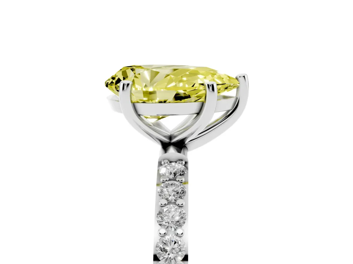 Fancy Yellow Pear Cut Diamond Solitaire Ring with Round Pavé Shoulders and Prong Setting Platinum