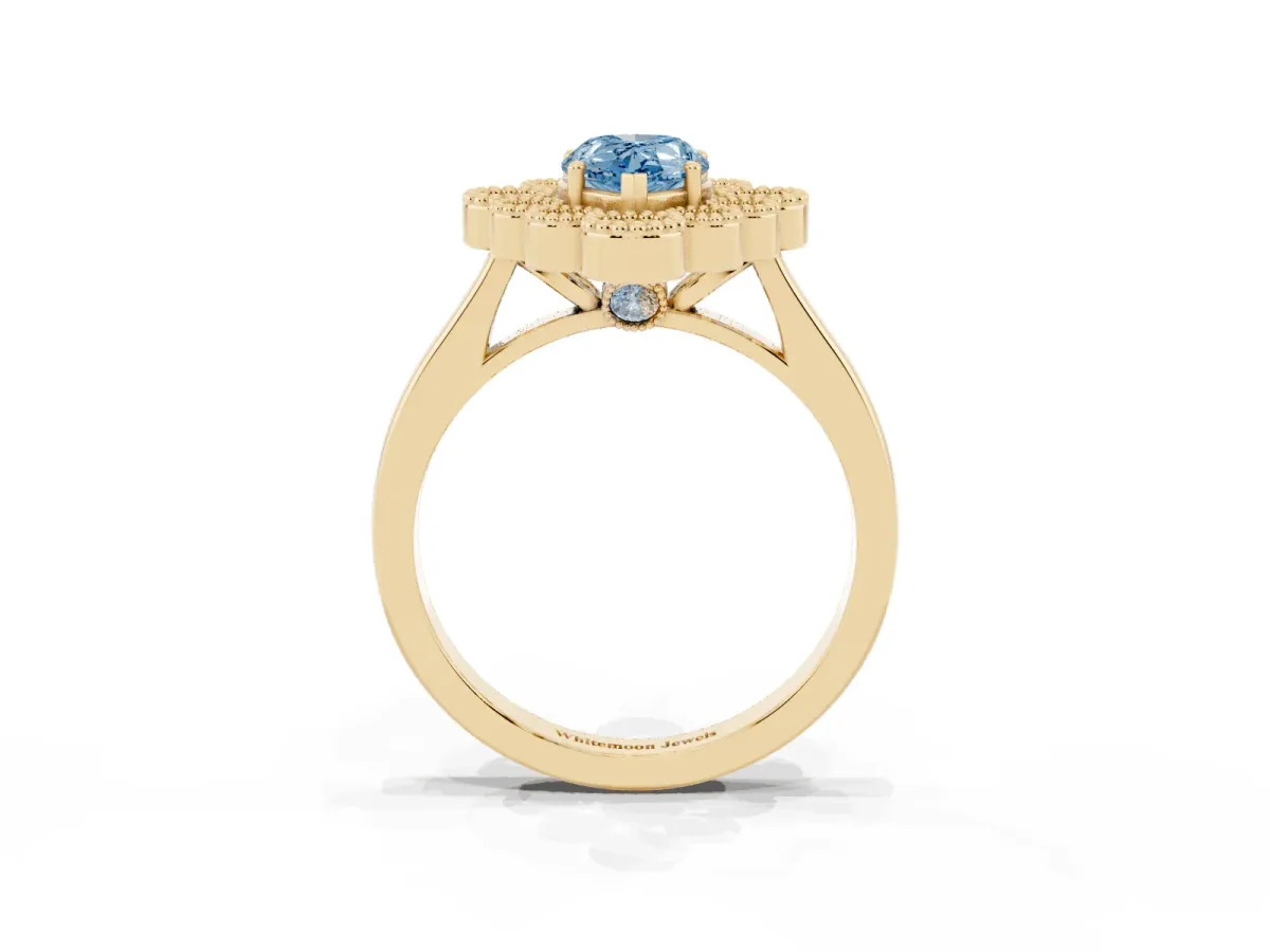 Fancy Blue Pear Cut Halo Diamond Cluster Engagement Ring with Milgrain Bezel Setting and Solitaire Band Yellow gold