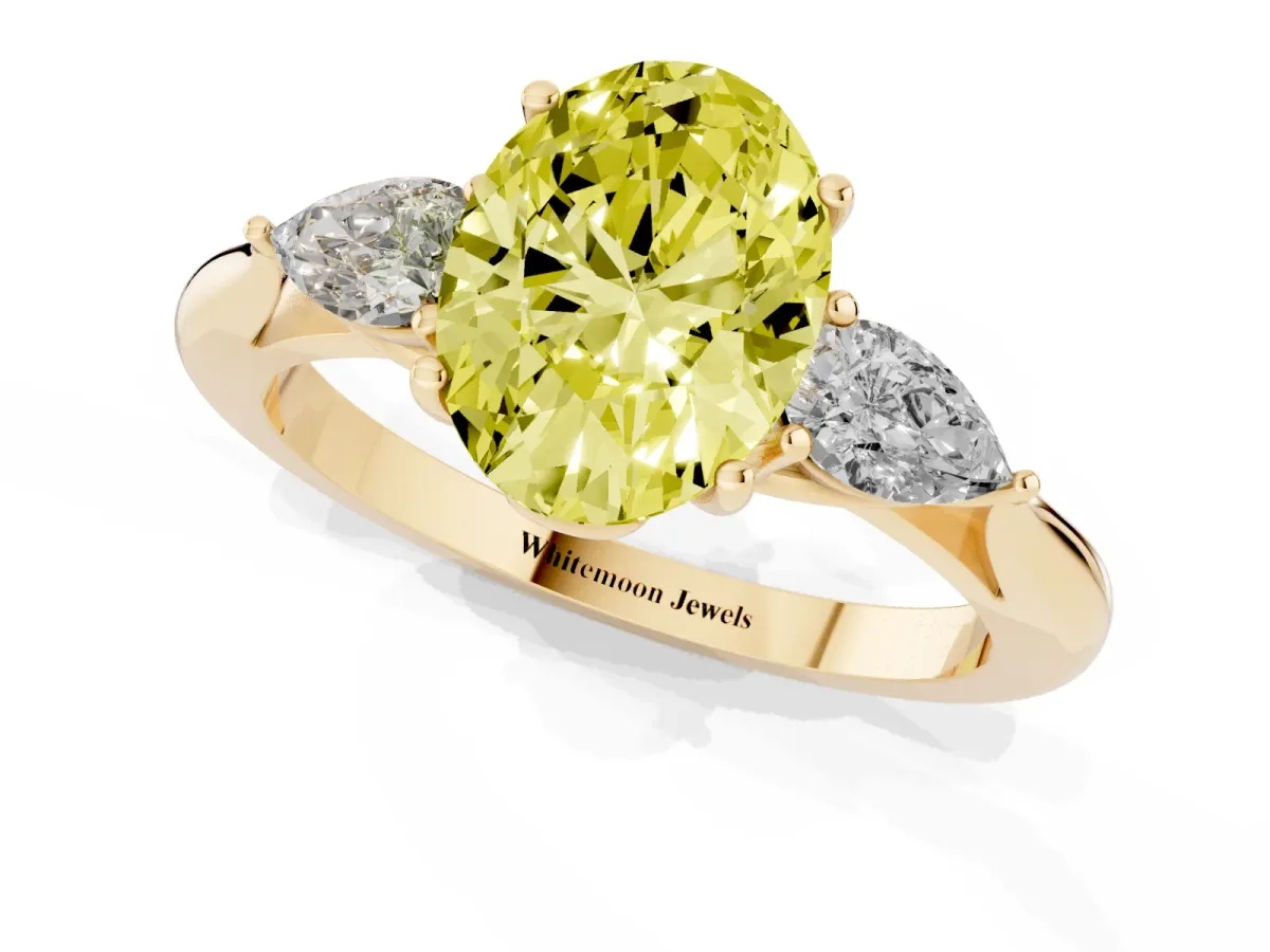Fancy Yellow Three-Stone Oval Cut Brilliant Diamond Solitaire Ring with Tapered Band and Four-Prong Setting Yellow gold