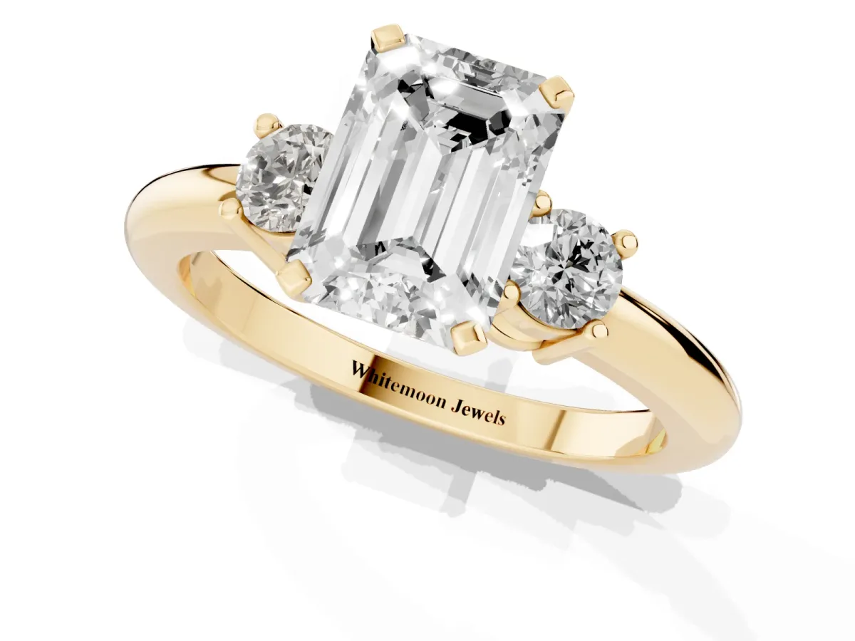 Three-Stone Emerald Cut Cut Diamond Solitaire with Prong Setting and Classic Band Yellow gold