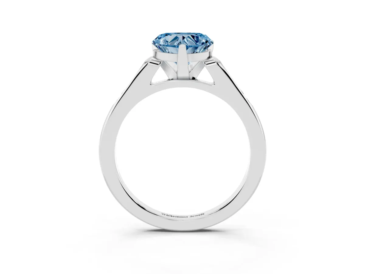 Fancy Blue Heart Cut Diamond Solitaire Ring with Channel Set Round Band and Prong Setting Silver