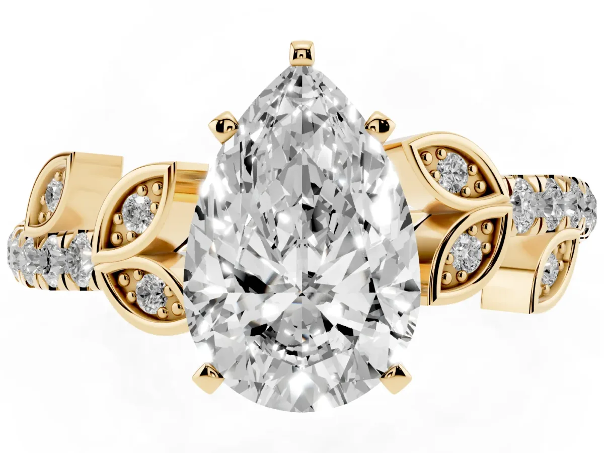 Pear Cut Solitaire Leaf-Inspired Diamond Ring with Pavé Band and Four-Prong Setting Yellow gold