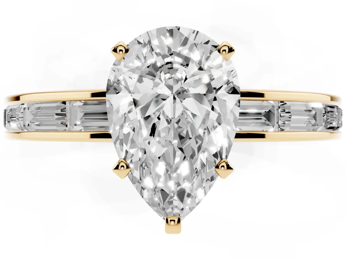 Pear Cut Solitaire Diamond Ring with Channel-Set Baguette Band and Four-Prong Setting Yellow gold
