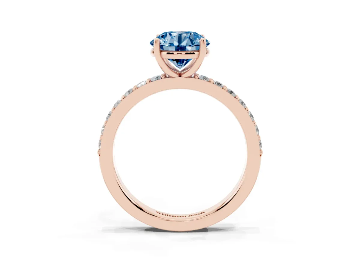 Fancy Blue Round Cut Cut Diamond Solitaire with Pave Band and Four-Prong Setting Rose gold