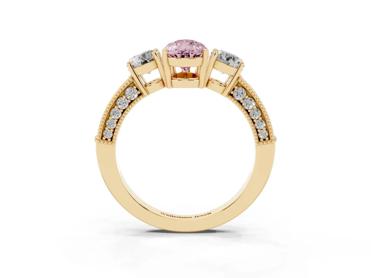 Fancy Pink Pear Cut Three-Stone Diamond Ring with Pavé Band and Four-Prong Setting Yellow gold