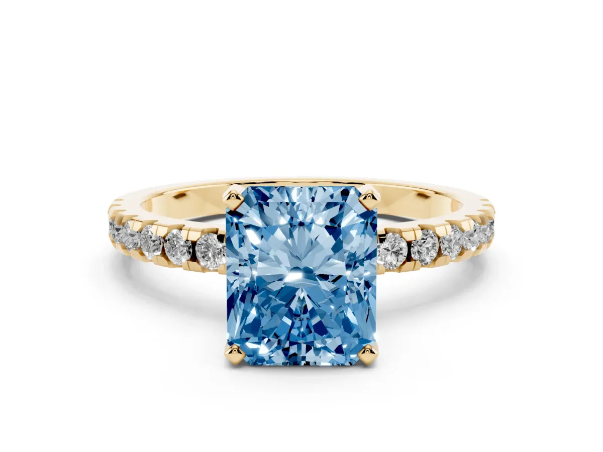 Fancy Blue Radiant Cut Diamond Solitaire Ring with Round Pavé Band and Four-Prong Setting Yellow gold