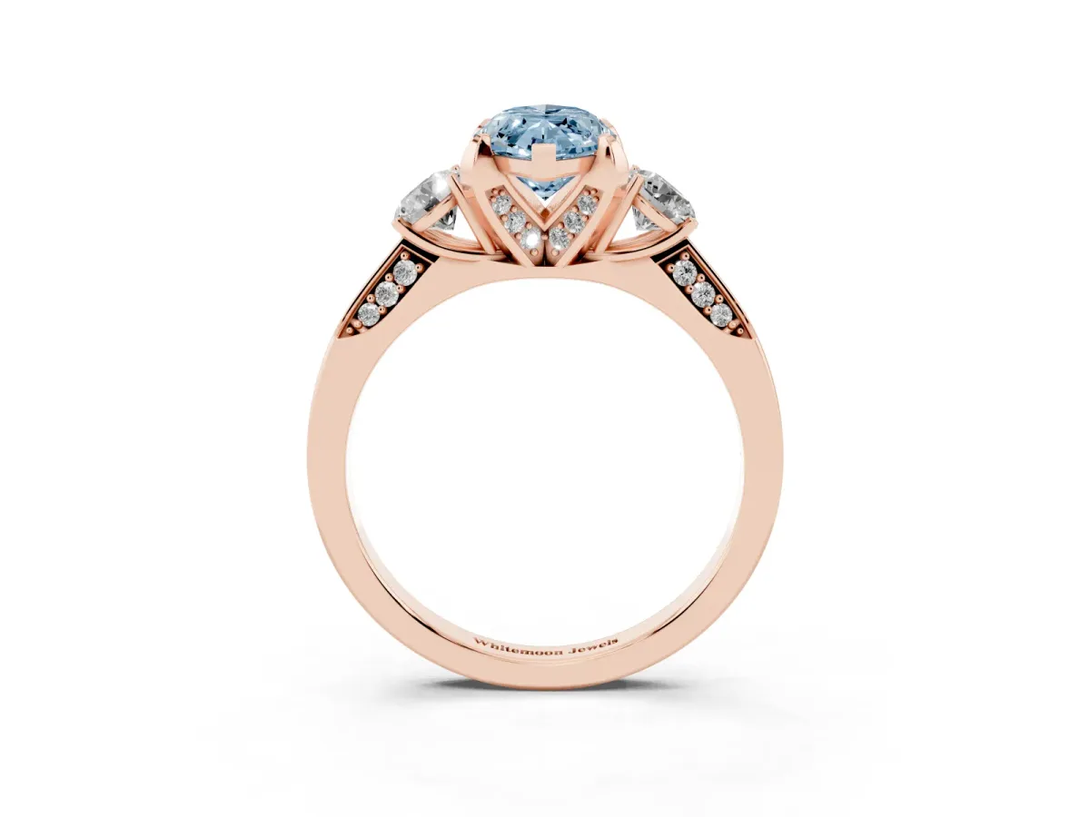 Fancy Blue Marquise Cut Brilliant Three-Stone Diamond Ring with Pavé Band and Four-Prong Setting Rose gold
