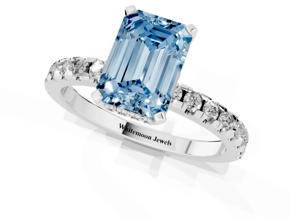 Fancy Blue Emerald Cut Diamond Solitaire Ring with Round Pavé Band and Four-Prong Setting Silver