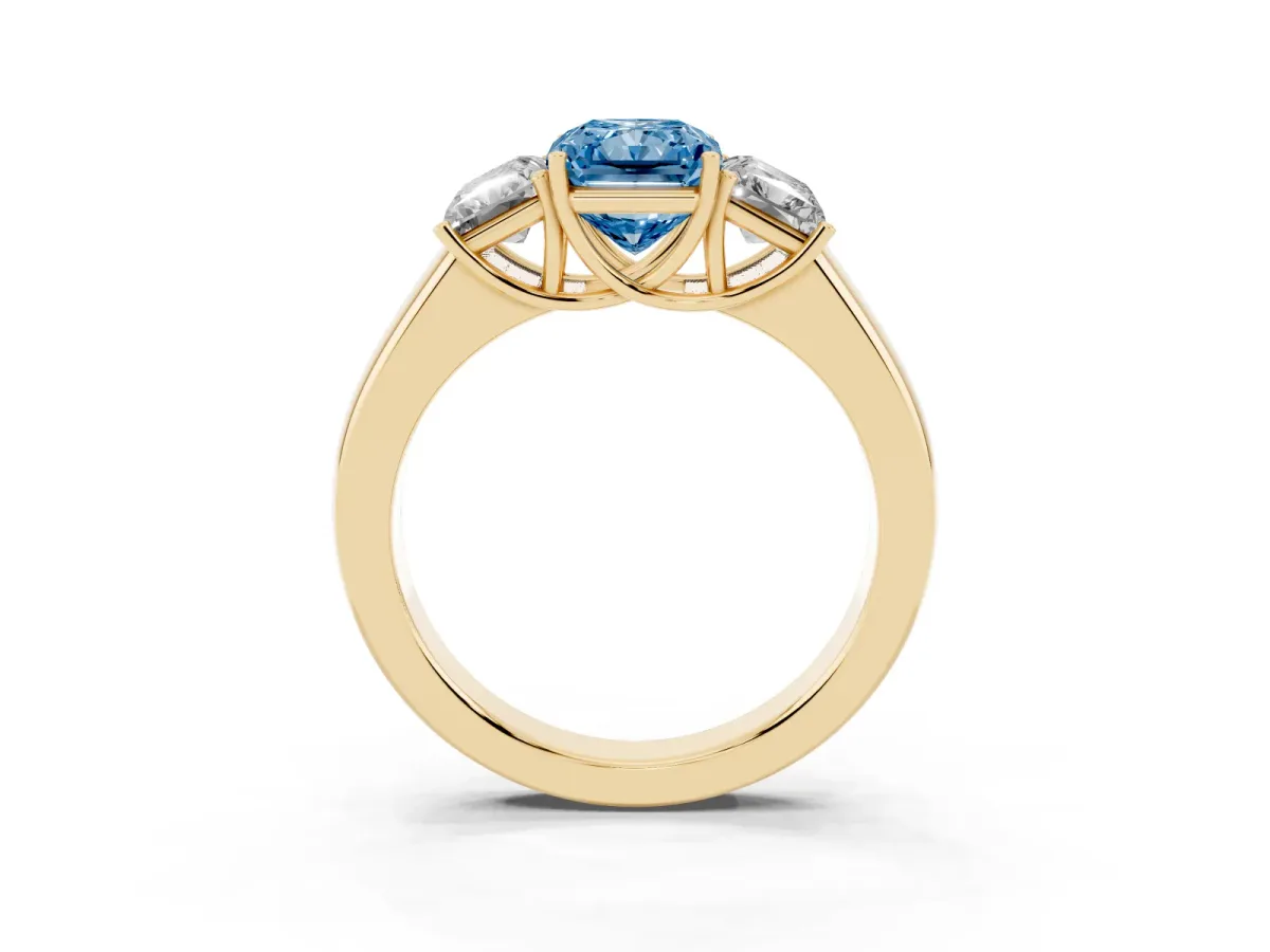 Fancy Blue Three-Stone Radiant Cut Cut Diamond Ring with Prong Setting and Classic Band Yellow gold