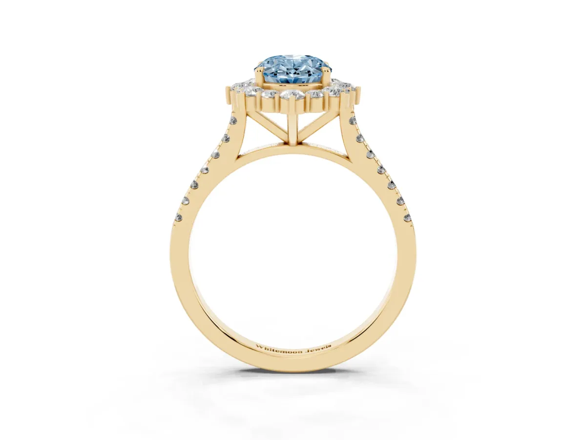 Fancy Blue Oval Cut Halo Diamond Ring with Pavé Band and Prong Setting Yellow gold