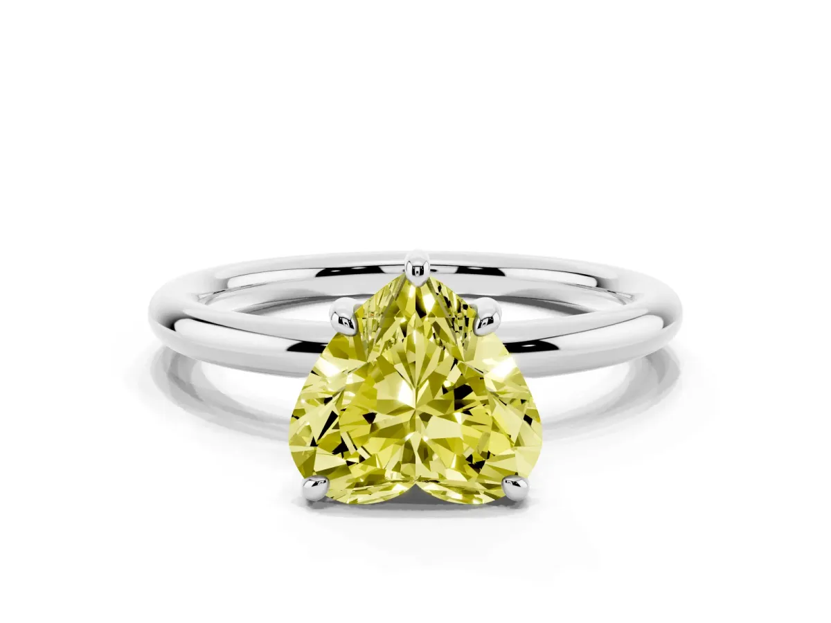 Fancy Yellow Heart Cut Solitaire Diamond Ring with Four-Prong Setting on a Plain Band Platinum