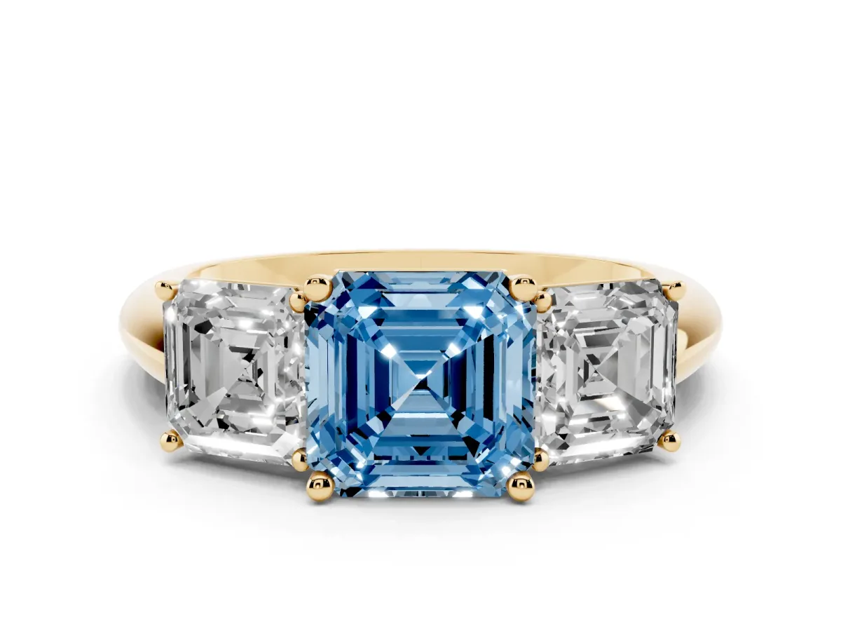 Fancy Blue Three-Stone Asscher Cut Cut Diamond Engagement Ring with Prong Setting on a White Gold Band Yellow gold