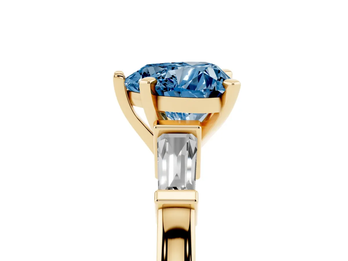 Fancy Blue Heart Cut Cut Diamond Solitaire Ring with Tapered Baguette Accents and Four-Prong Setting Yellow gold
