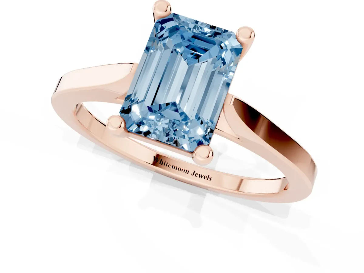 Fancy Blue Emerald Cut Solitaire Diamond Ring with Four-Prong Setting and Tapered Band Rose gold