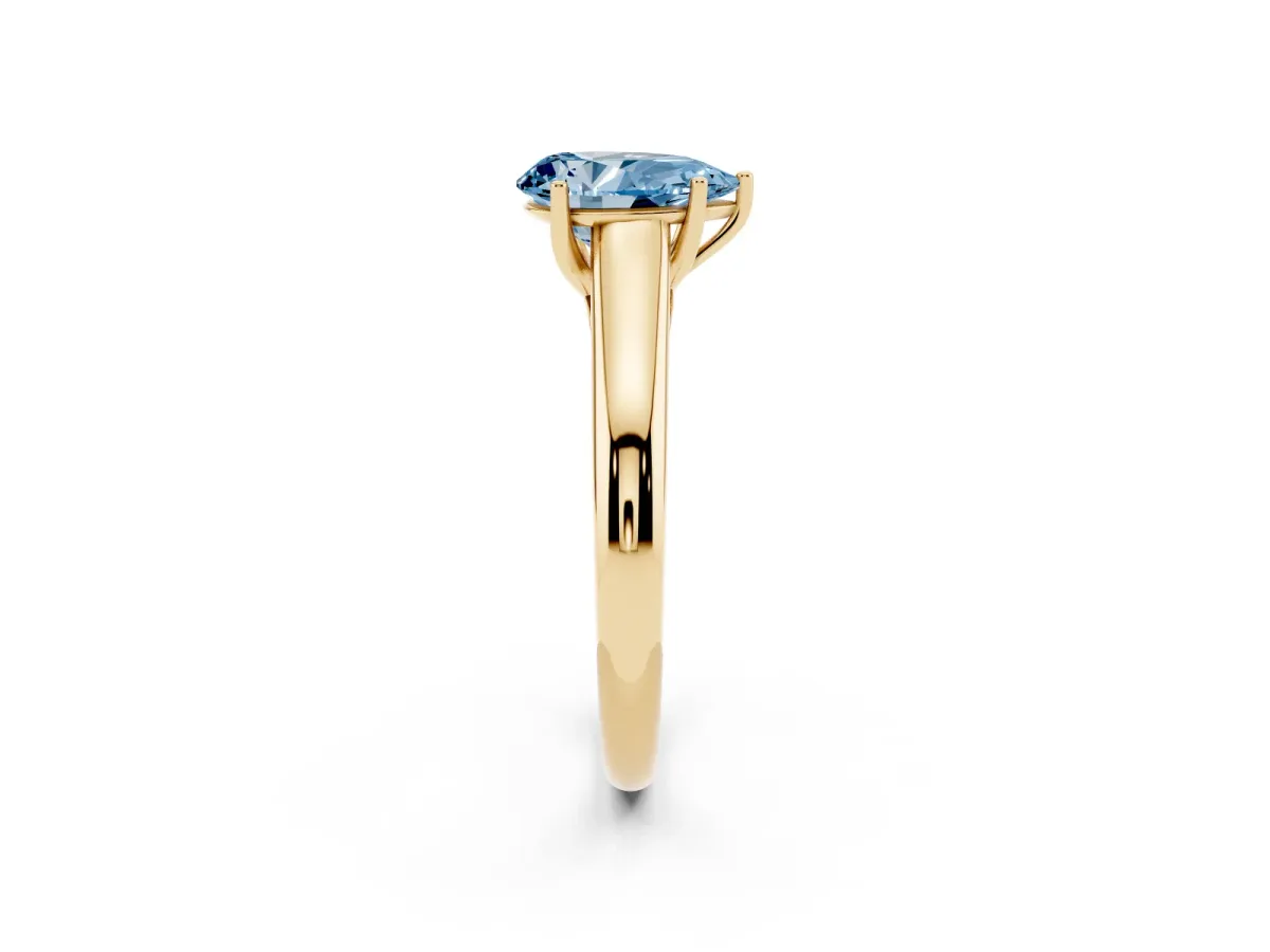 Fancy Blue Pear Cut Solitaire Engagement Ring with Tapered Band and Four-Prong Setting Yellow gold