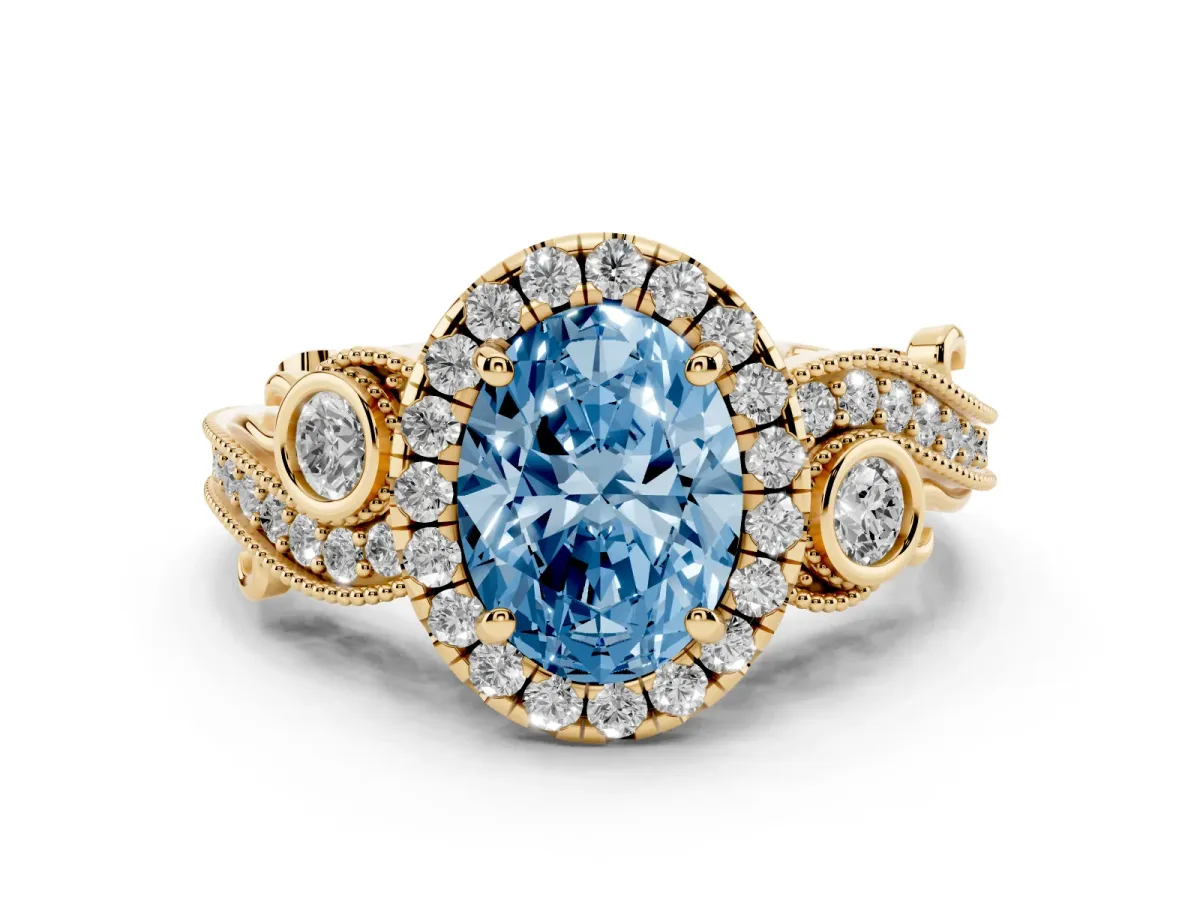 Fancy Blue Oval Cut Diamond Halo Ring with Milgrain Pavé Band and Four-Prong Setting Yellow gold