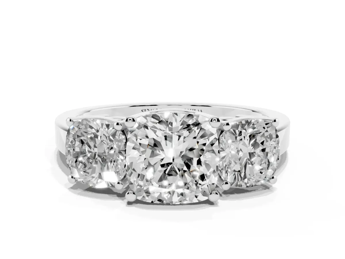 Three-Stone Cushion Cut Cut Diamond Engagement Ring with Flat Band and Four-Prong Setting Silver