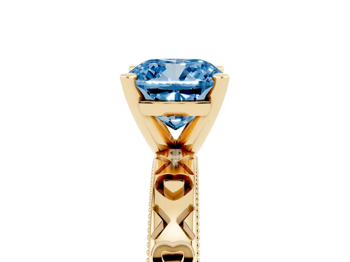 Fancy Blue Cushion Cut Solitaire Diamond Engagement Ring with XO Engraved Band and Four-Prong Setting Yellow gold