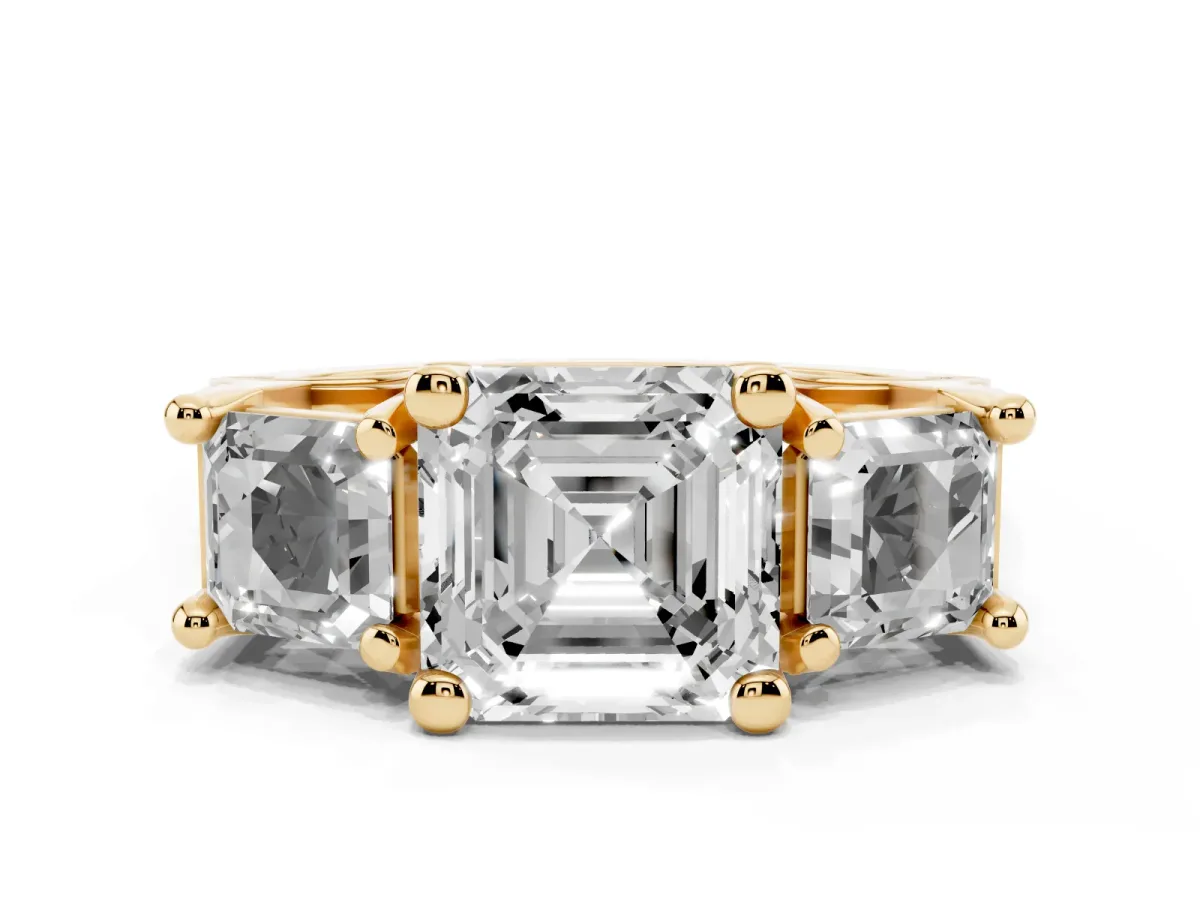 Asscher Cut Diamond Three-Stone Ring with Channel Set Band and Four-Prong Setting Yellow gold