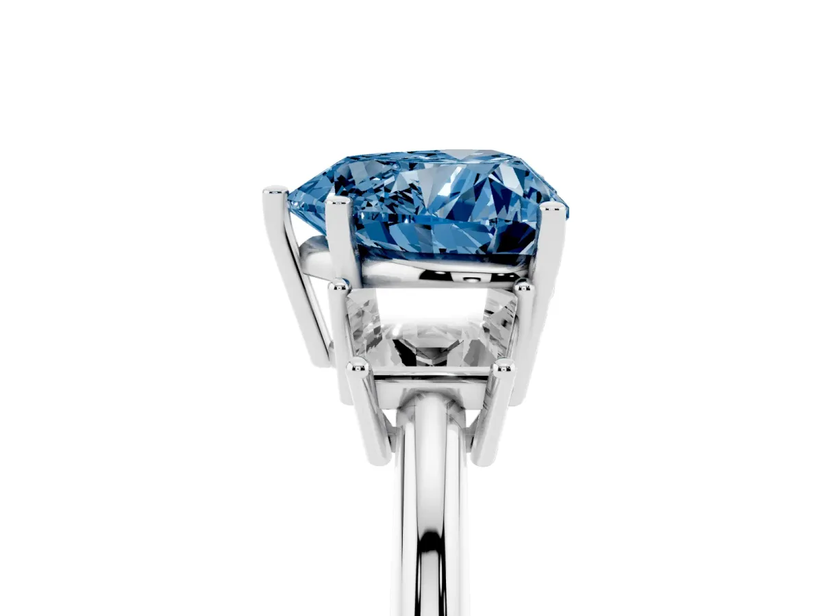 Fancy Blue Heart Cut Diamond Three-Stone Ring with Trapezoid Side Stones and Prong Setting Silver