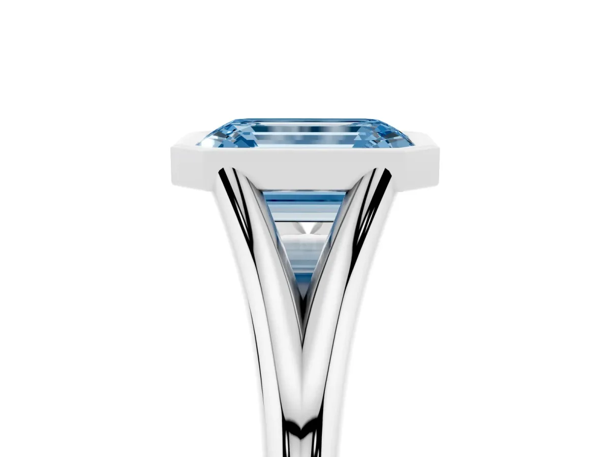 Fancy Blue Bezel Set Emerald Cut Cut Solitaire Ring with Tapered Band Silver