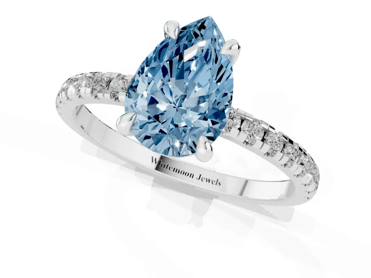Fancy Blue Pear Cut Diamond Brilliant Solitaire Ring with Pavé Band and Four-Prong Setting Silver